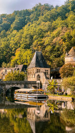 Reflection of an old house on a river in the middle of france 