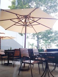 Empty chairs and tables in restaurant