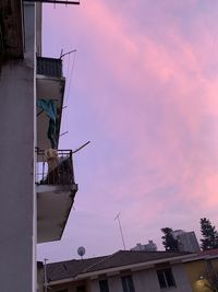 Low angle view of building against sky at sunset