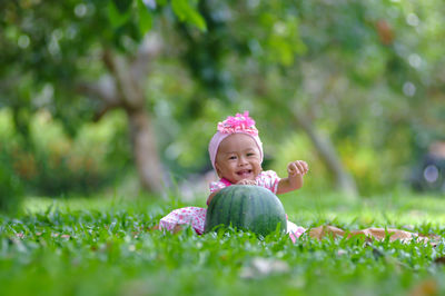 High angle view of cute girl standing on grassy field