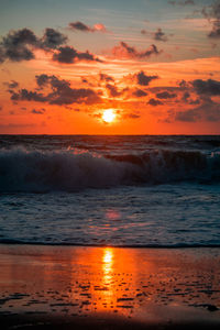 Scenic view of sea against romantic sky at sunset