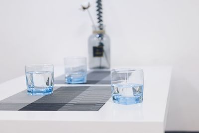 Water in glasses on table at office