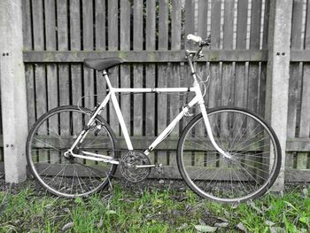 Bicycle leaning on wall in front of house