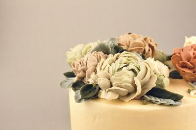 Close-up of rose bouquet on white table
