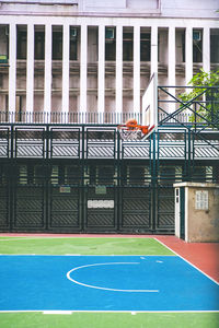 Basketball hoop against building