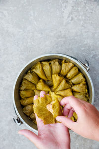 Cropped hand of person holding food