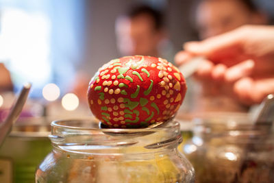 Close-up of easter egg on glass jar