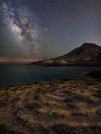 Scenic view of sea against sky at night