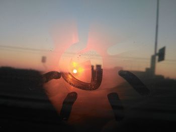 Close-up of water against sky during sunset