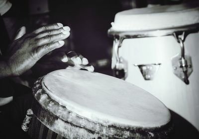 Cropped image of man playing drums