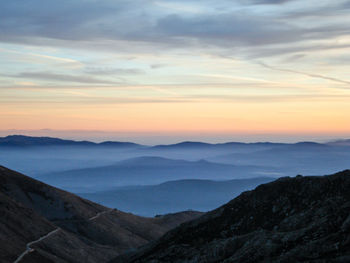 Scenic view of mountains against sky during sunset