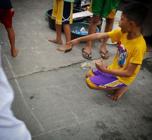 Boy playing with arms raised