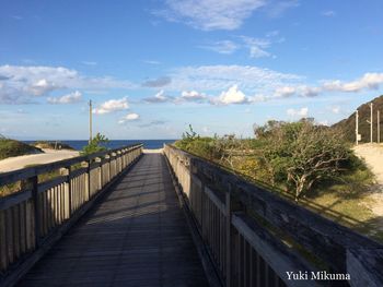 Bridge over sea against sky
