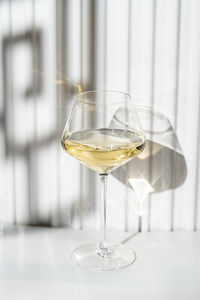 Close-up of wineglass on table