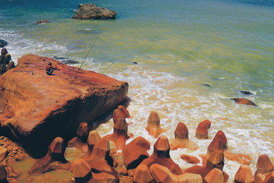 High angle view of stones on beach