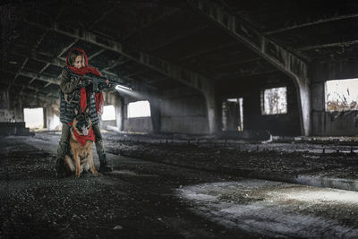 Dog standing in abandoned building