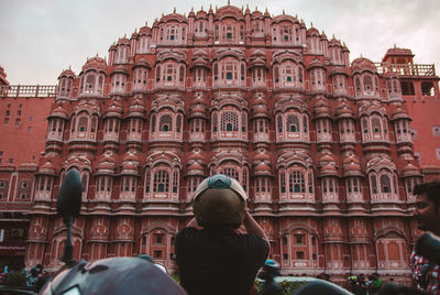 Rear view of woman walking in historic building