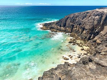 Scenic view of sea shore against sky