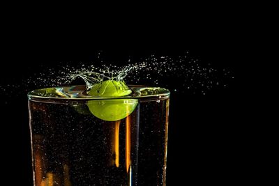 Close-up of drink against black background