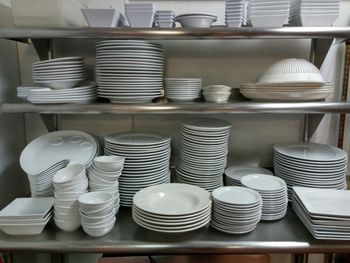 View of plates on shelf