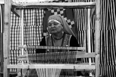 Woman weaving at workshop