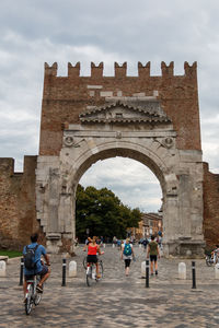 Group of people in front of historical building