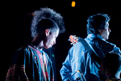 Musicians playing guitar at concert