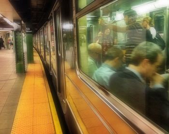 Blurred motion of train at railroad station