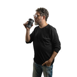 Full length of a man drinking glass against white background