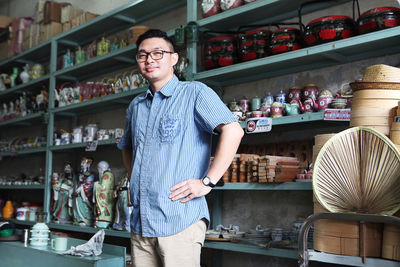 Portrait of man standing in store