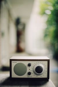 Close-up of telephone booth on table