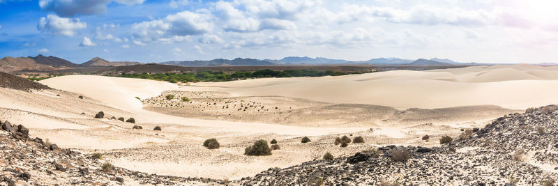 Panoramic view of desert against sky