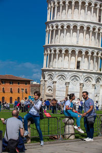 Group of people in front of historical building