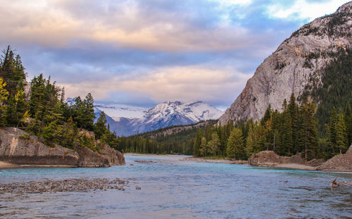 Scenic view of mountains against cloudy sky