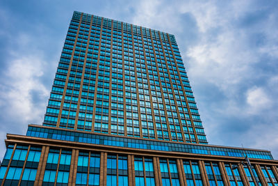 Low angle view of modern building against sky