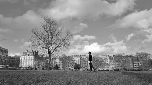 Full length of woman standing on grass