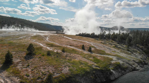 Scenic view of waterfall against sky