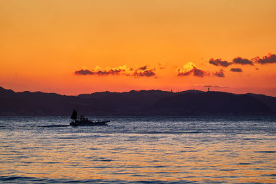 Scenic view of sea against sky during sunrise