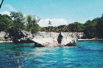 Scenic view of sea against blue sky