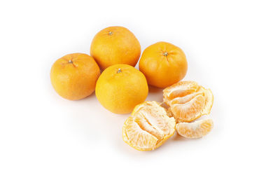 Close-up of oranges against white background