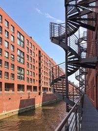 High angle view of river amidst buildings against sky