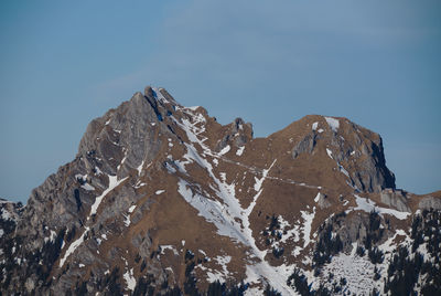 Scenic view of rocky mountains against clear sky