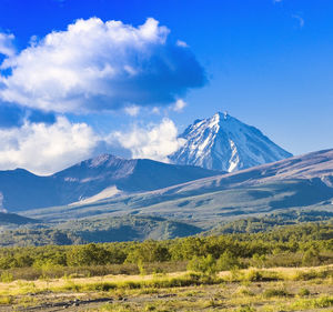 Panorama of kamchatka volcanoes koryak volcano in kamchatka in the autumn with a snow-covered top