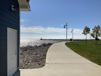 Road by sea against sky