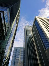 Low angle view of modern buildings against sky