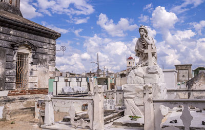 Statue of historic building against sky