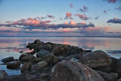 Scenic view of sea against sky at sunset