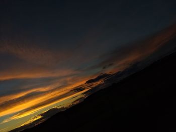 Low angle view of dramatic sky during sunset