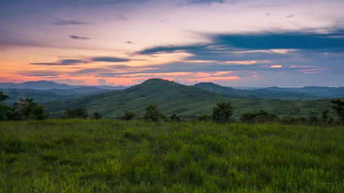 Scenic view of landscape against sky during sunset