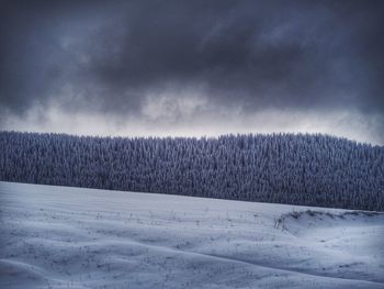 Scenic view of landscape against sky during winter